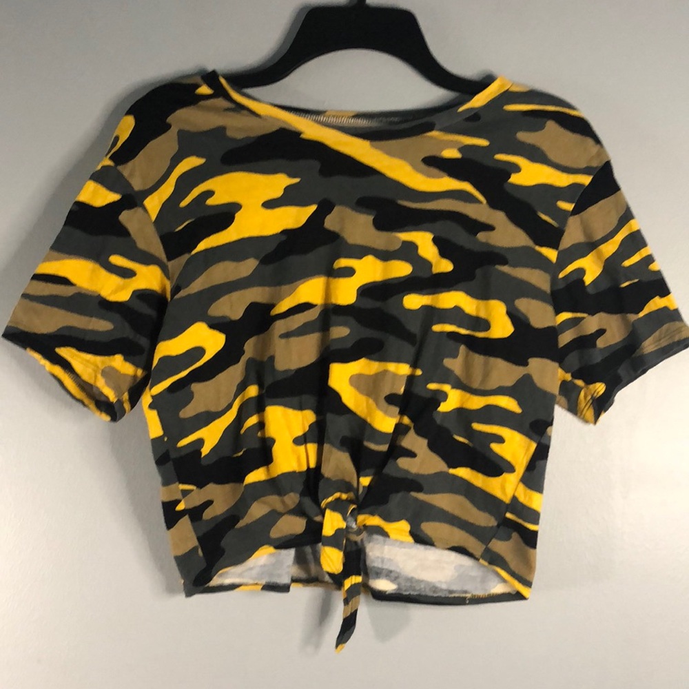 A cropped tied camouflage shirt